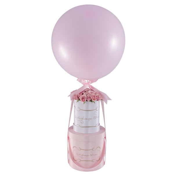 Pink mini spray roses in white hatbox balloon and ribbon.